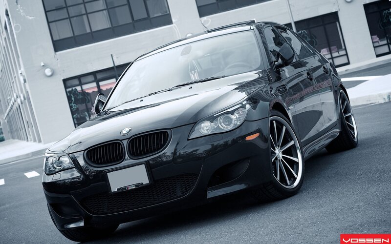 black bmw m5 on city street