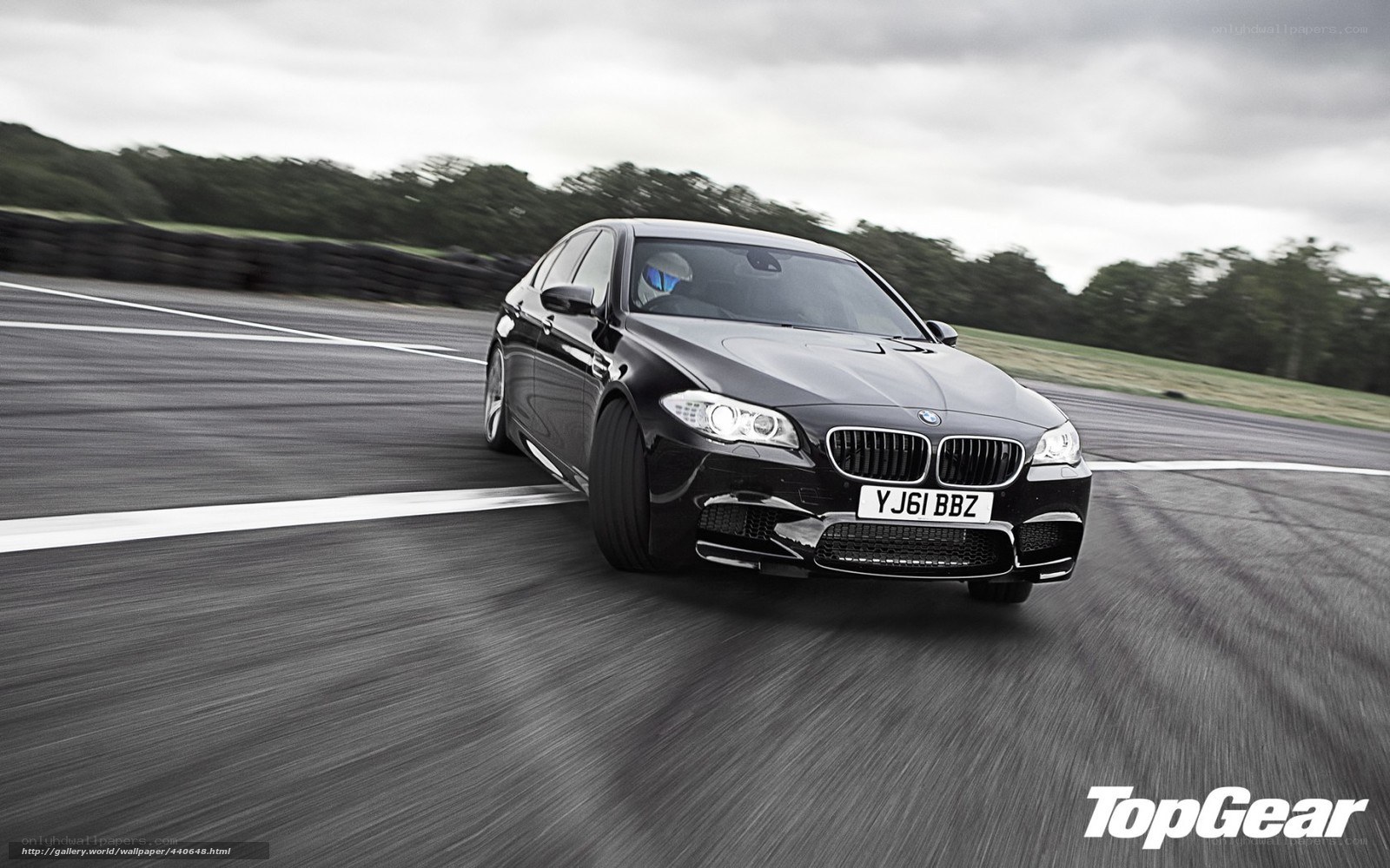 black bmw m5 on racetrack