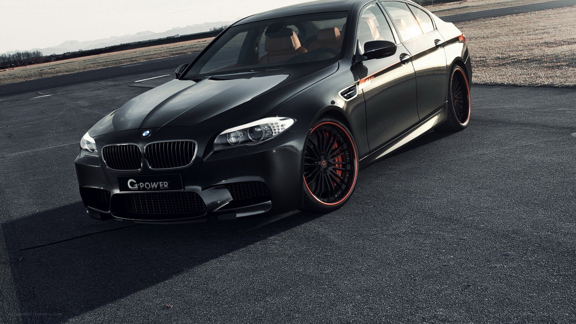 black bmw m5 on track