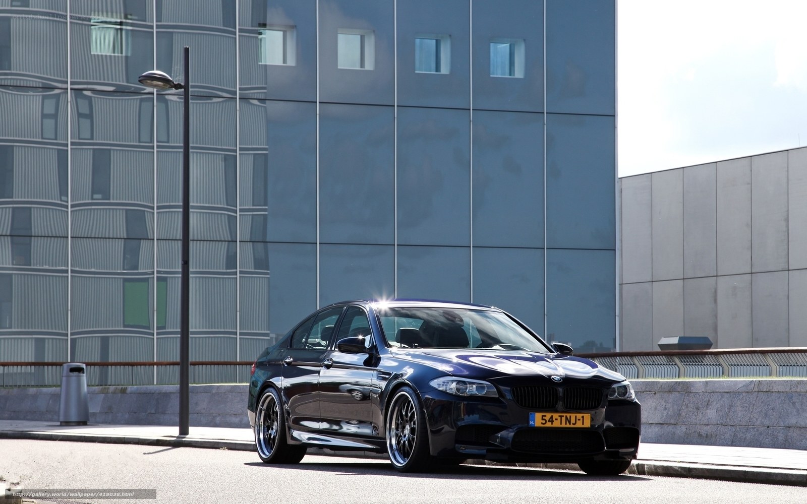 Black BMW M5 parked in city