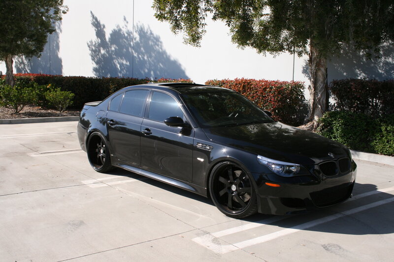 black bmw m5 parked in lot