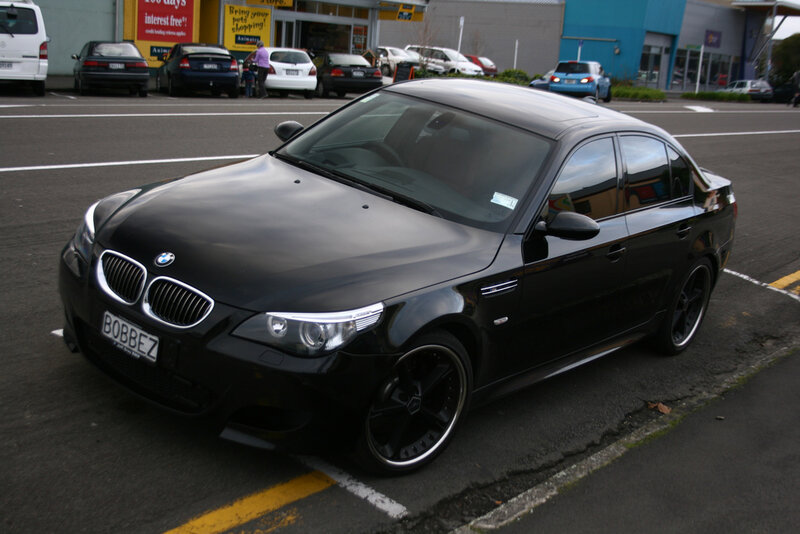 Black BMW M5 parked in lot