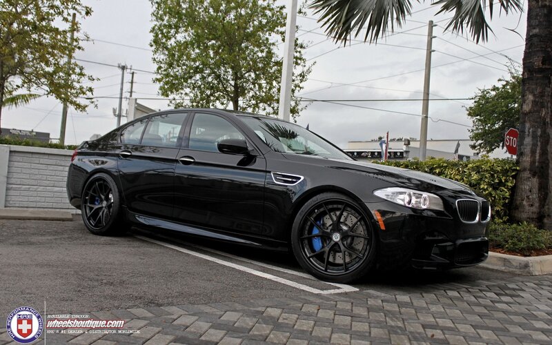 Black BMW M5 parked on street