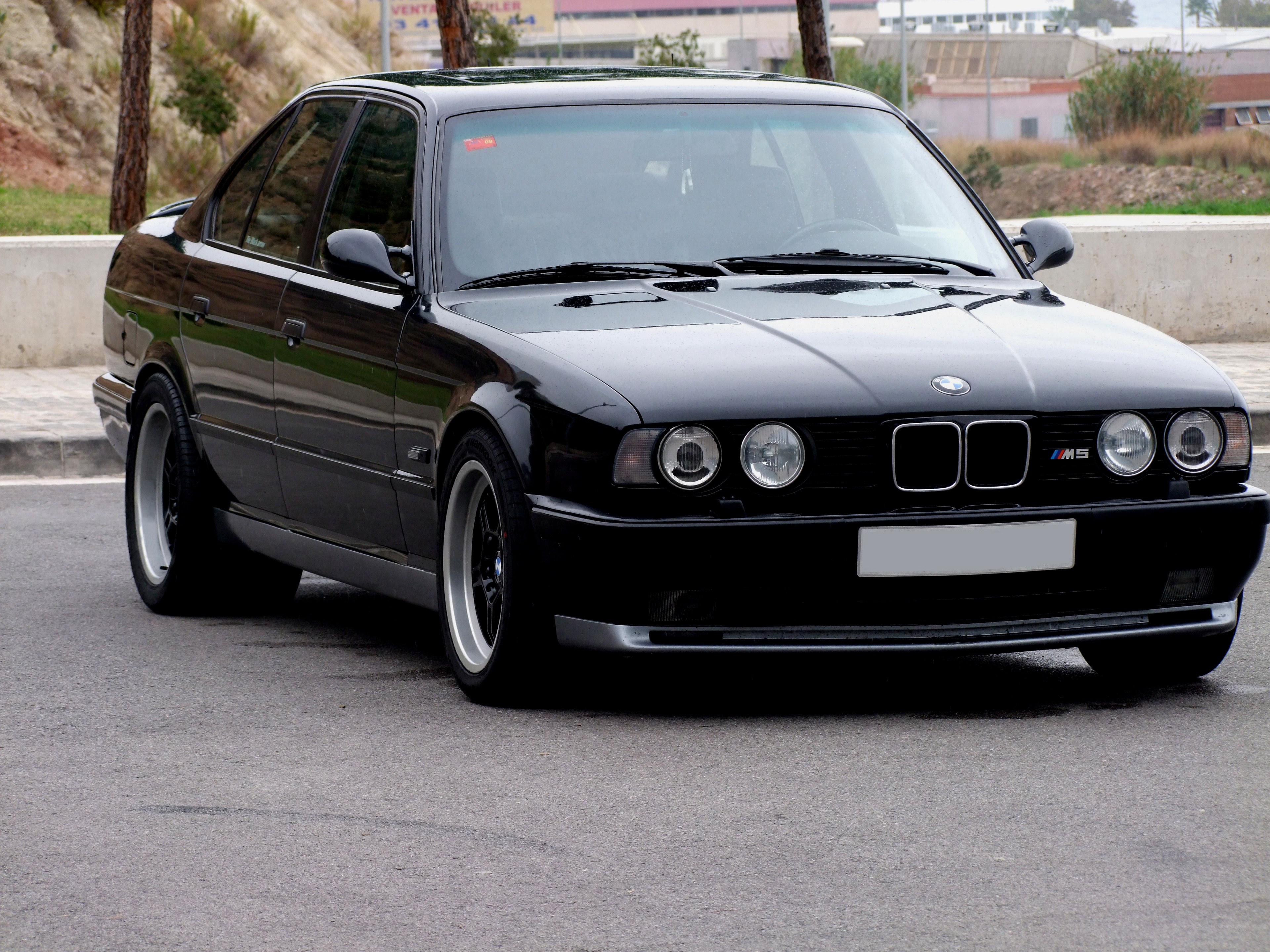 black bmw m5 sedan
