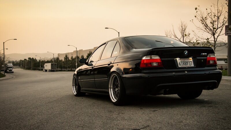 Black BMW M5 Sedan — Calm, Sunset
