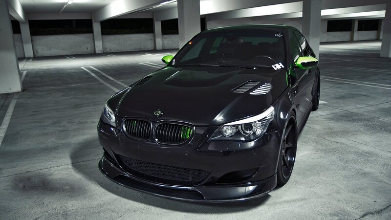 black bmw m5 with green accents