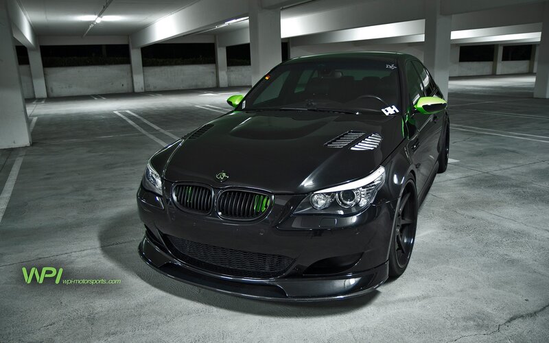 black bmw m5 with green accents