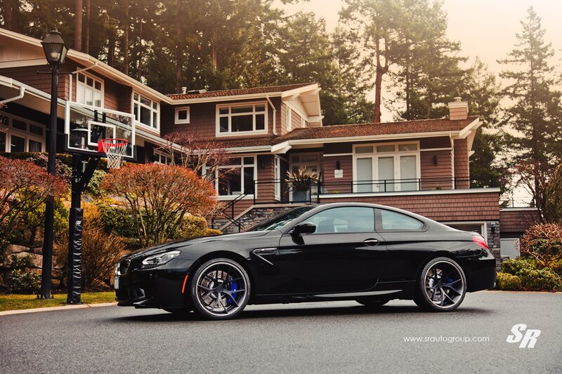 Black BMW M6 in driveway