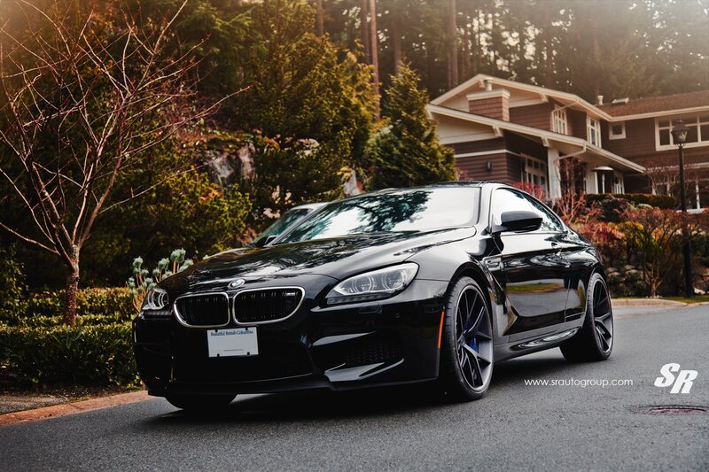 Black BMW M6 on a residential street