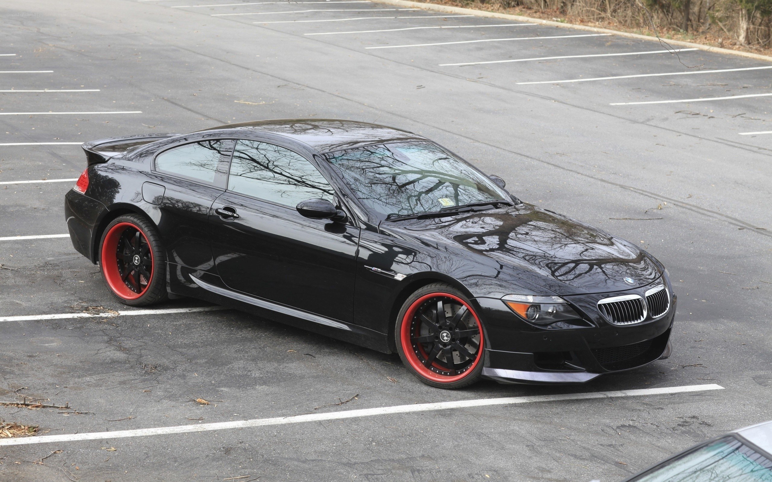 Black BMW M6 with red wheels