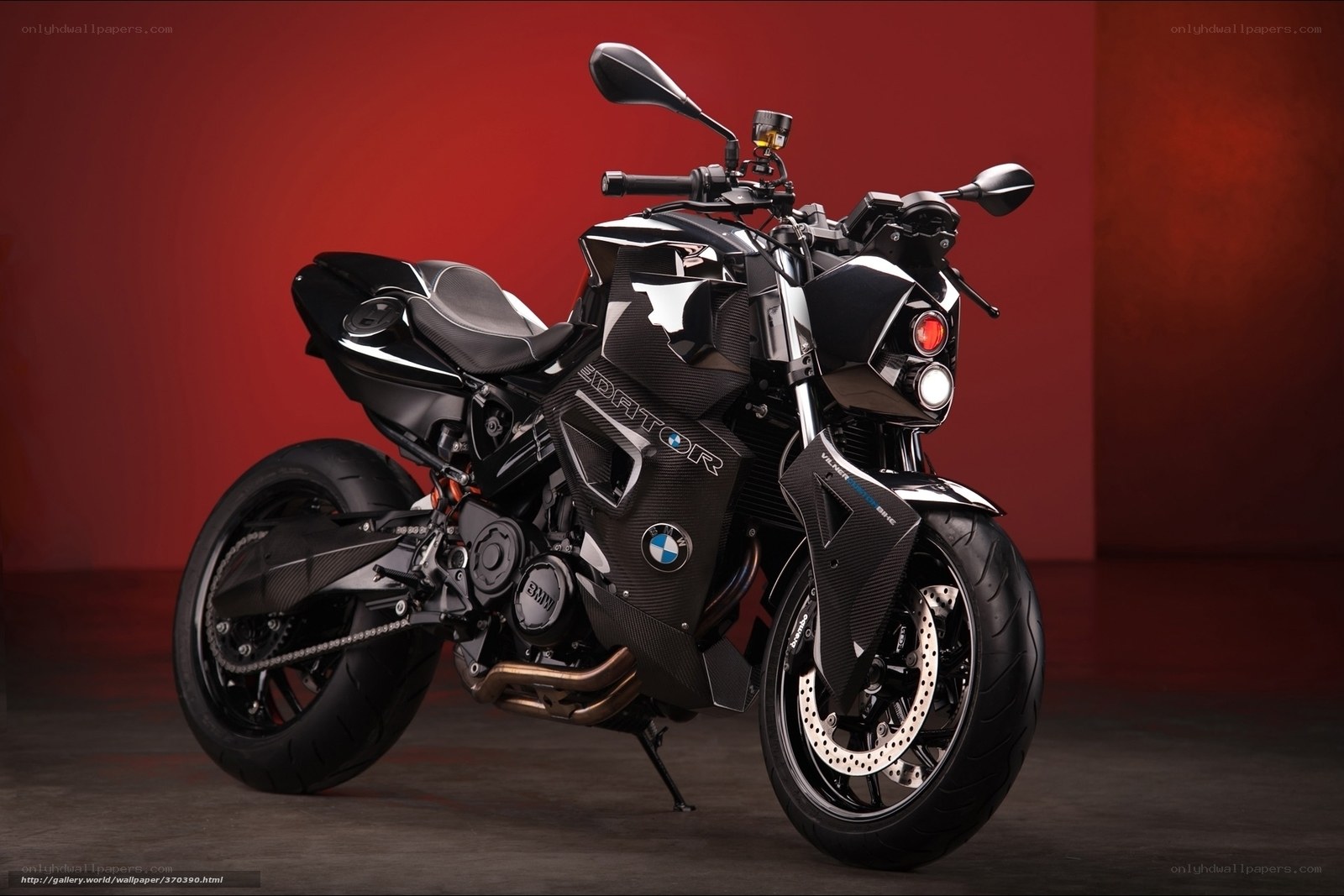 Black BMW motorcycle on red background