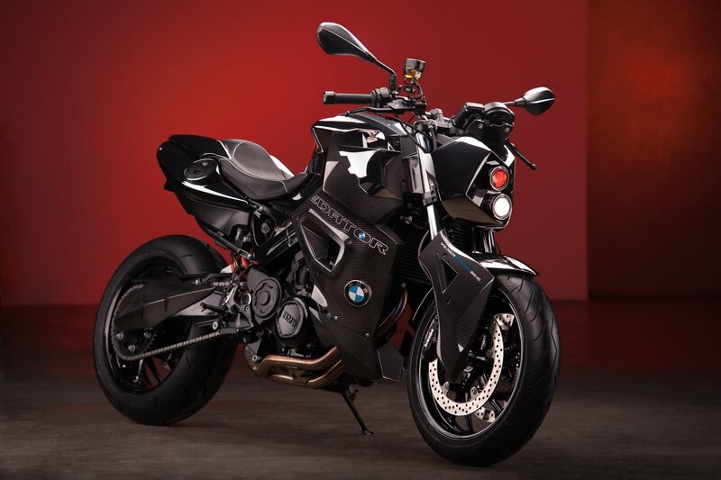 Black BMW motorcycle on red background