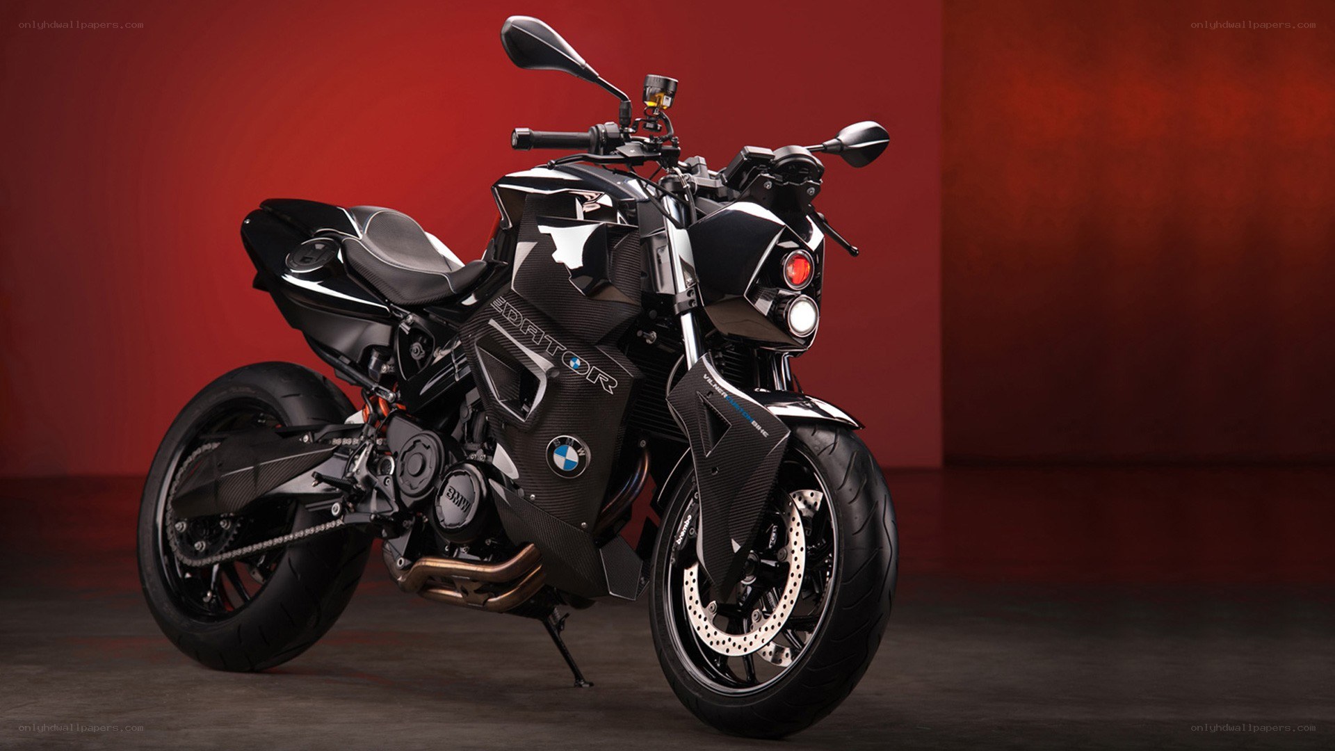 Black BMW motorcycle on red background