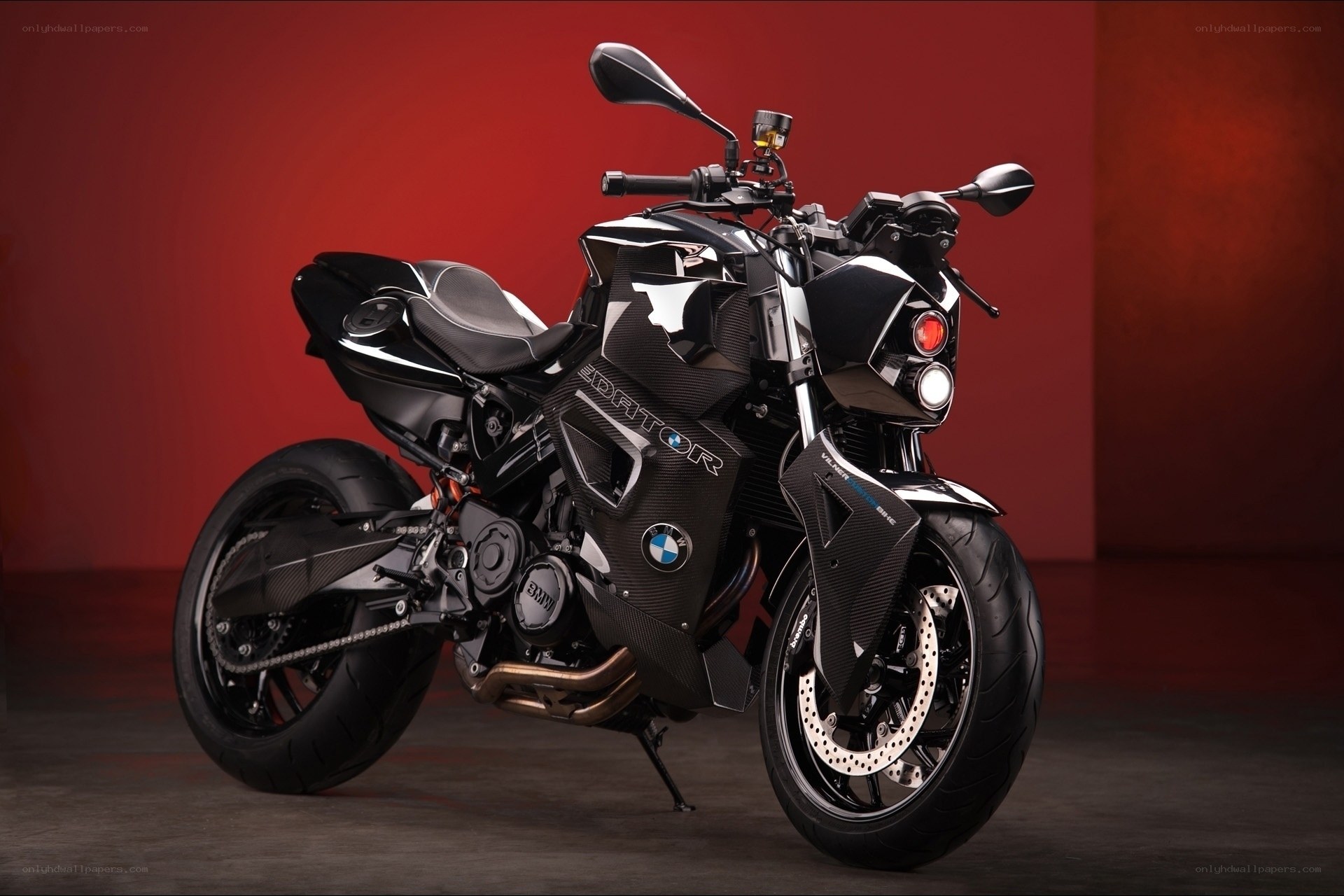Black BMW motorcycle on red background