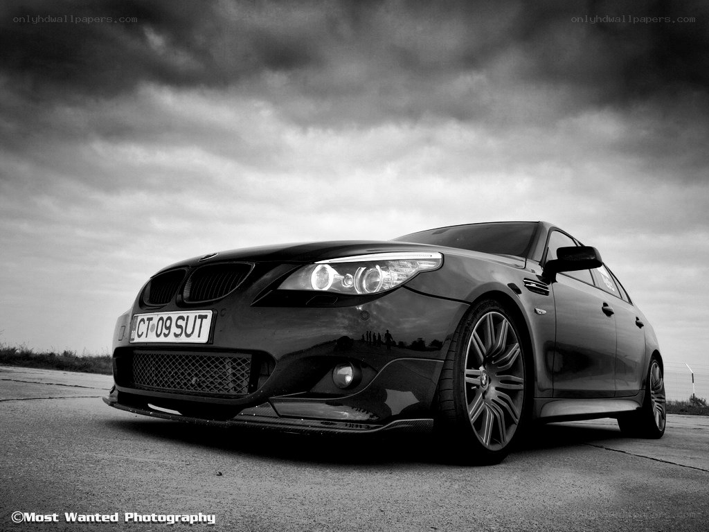 Black BMW on a cloudy day