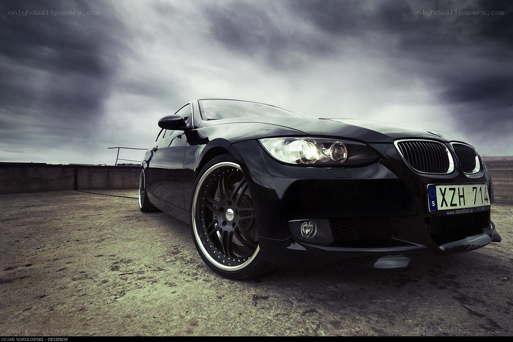Black BMW on a cloudy day