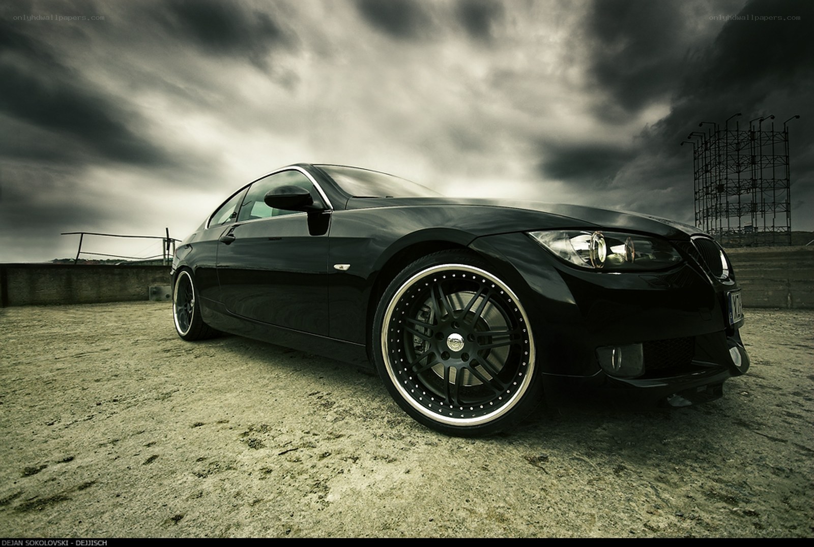 Black BMW on a cloudy day