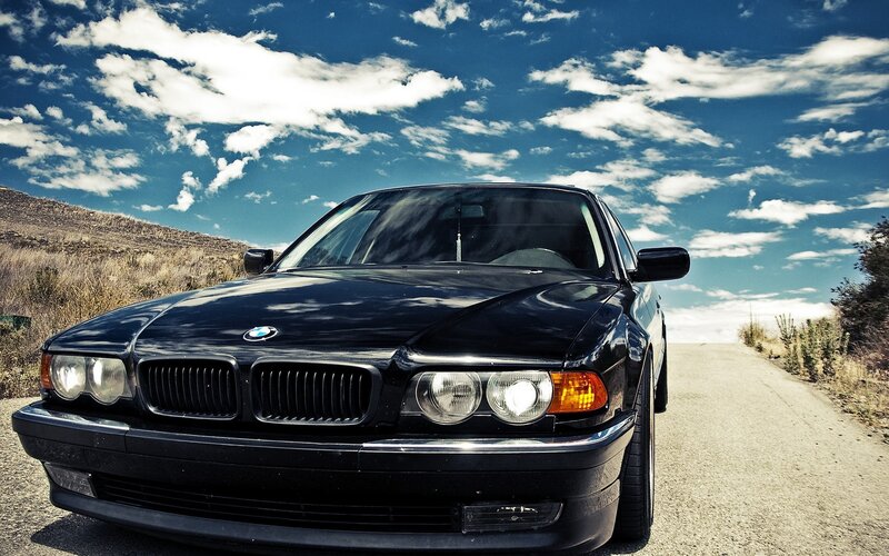 Black BMW on a country road