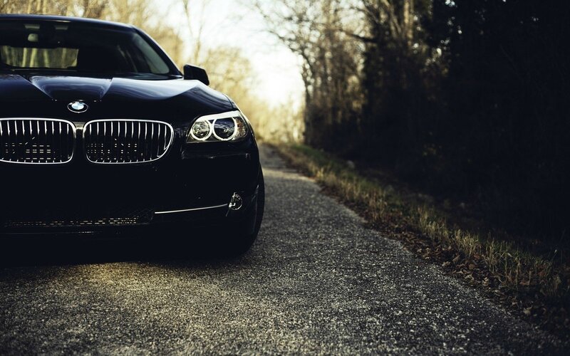 black bmw on a country road
