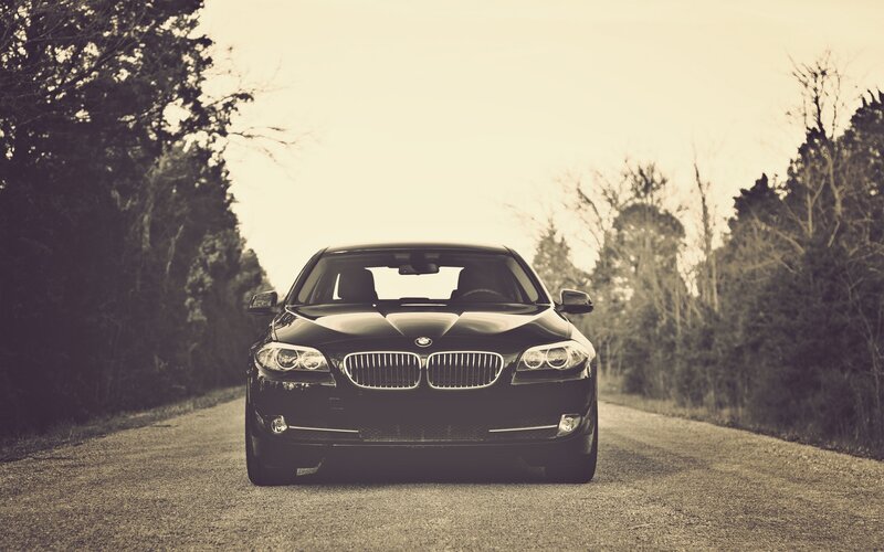 black bmw on a country road