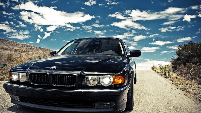 Black BMW on a country road