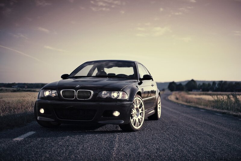 Black BMW on a country road
