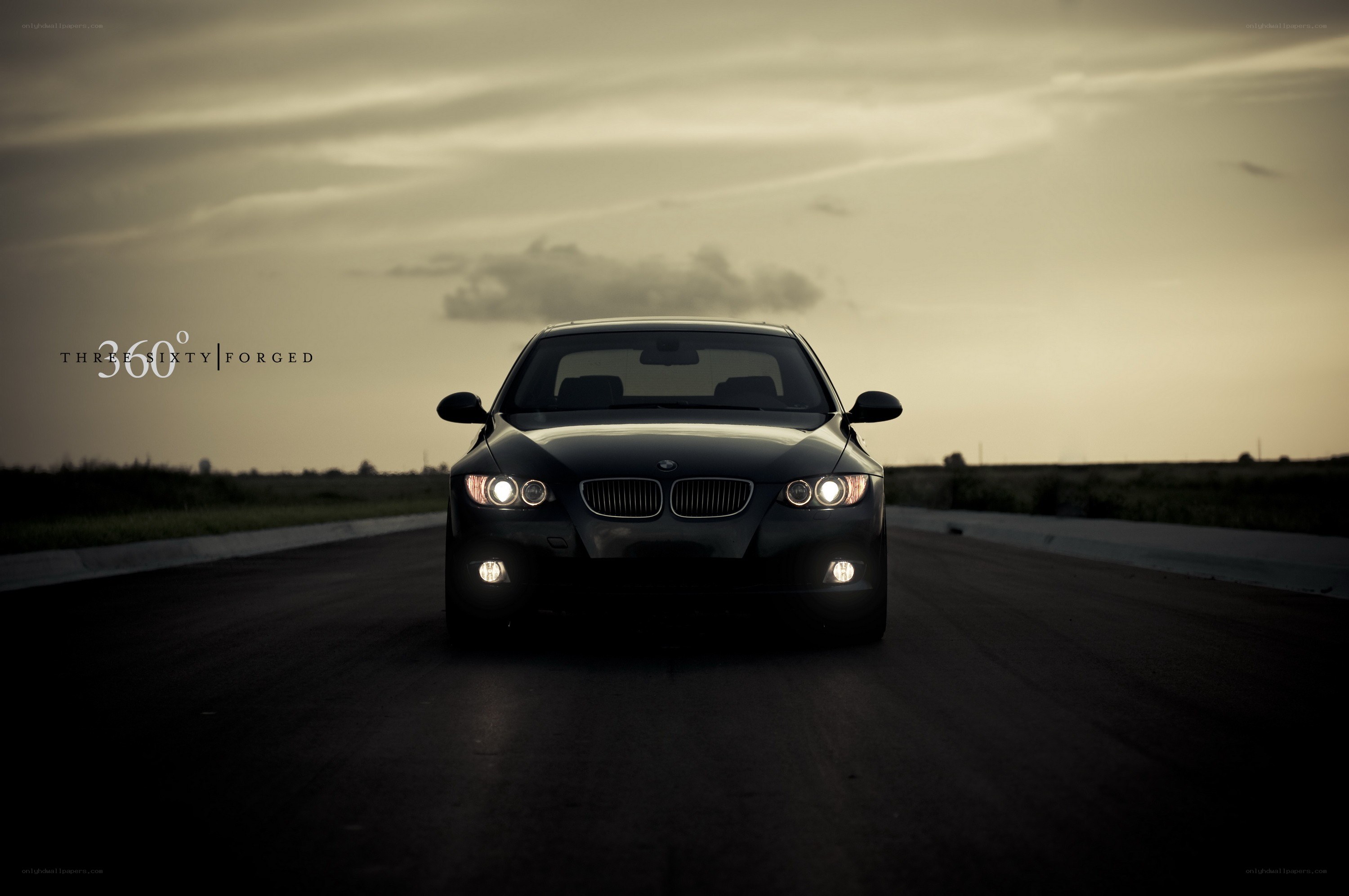 Black BMW on a dark road