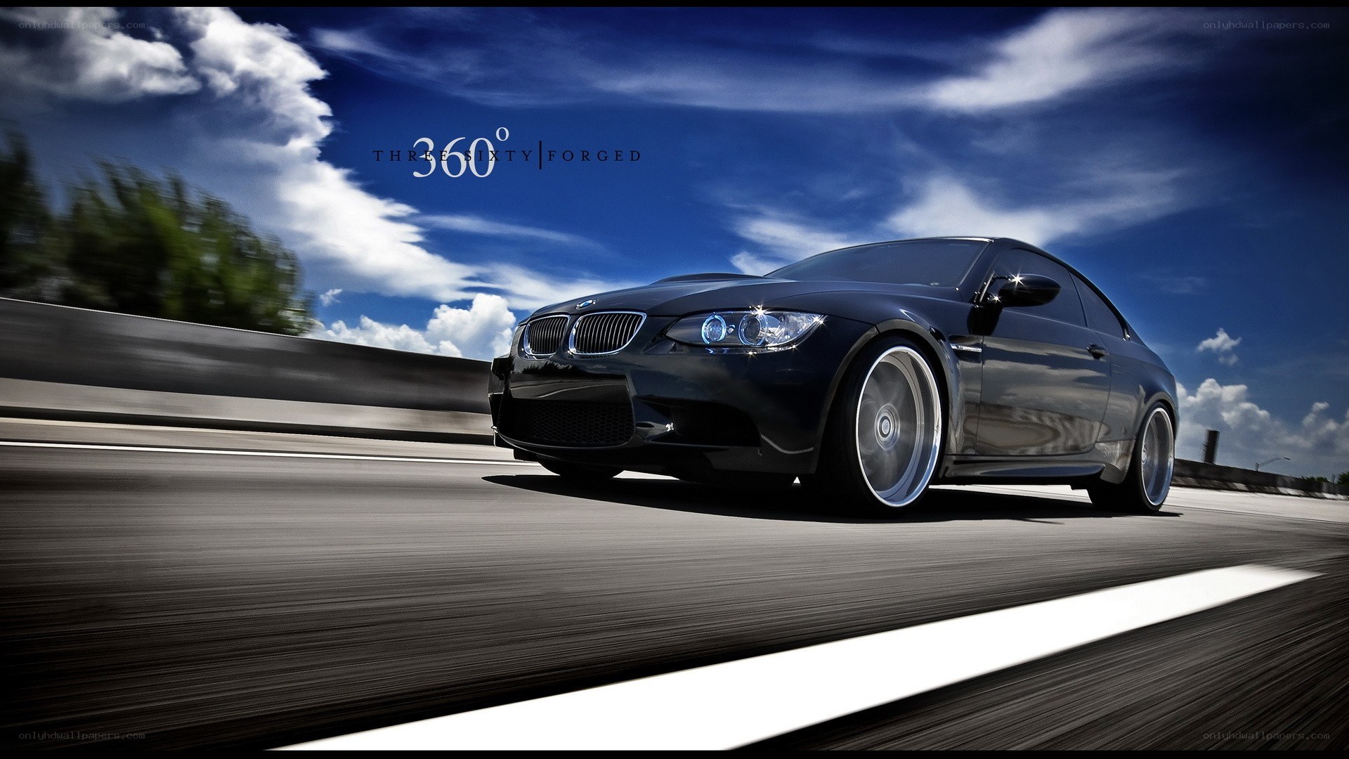 Black BMW on a highway