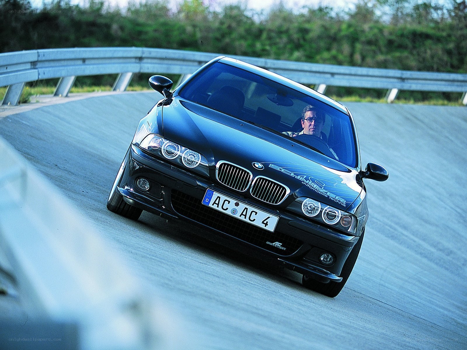 Black BMW on a racetrack