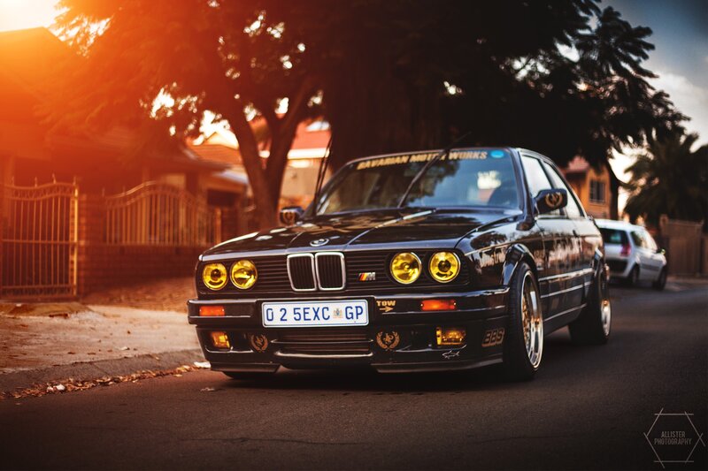 Black BMW on a residential street