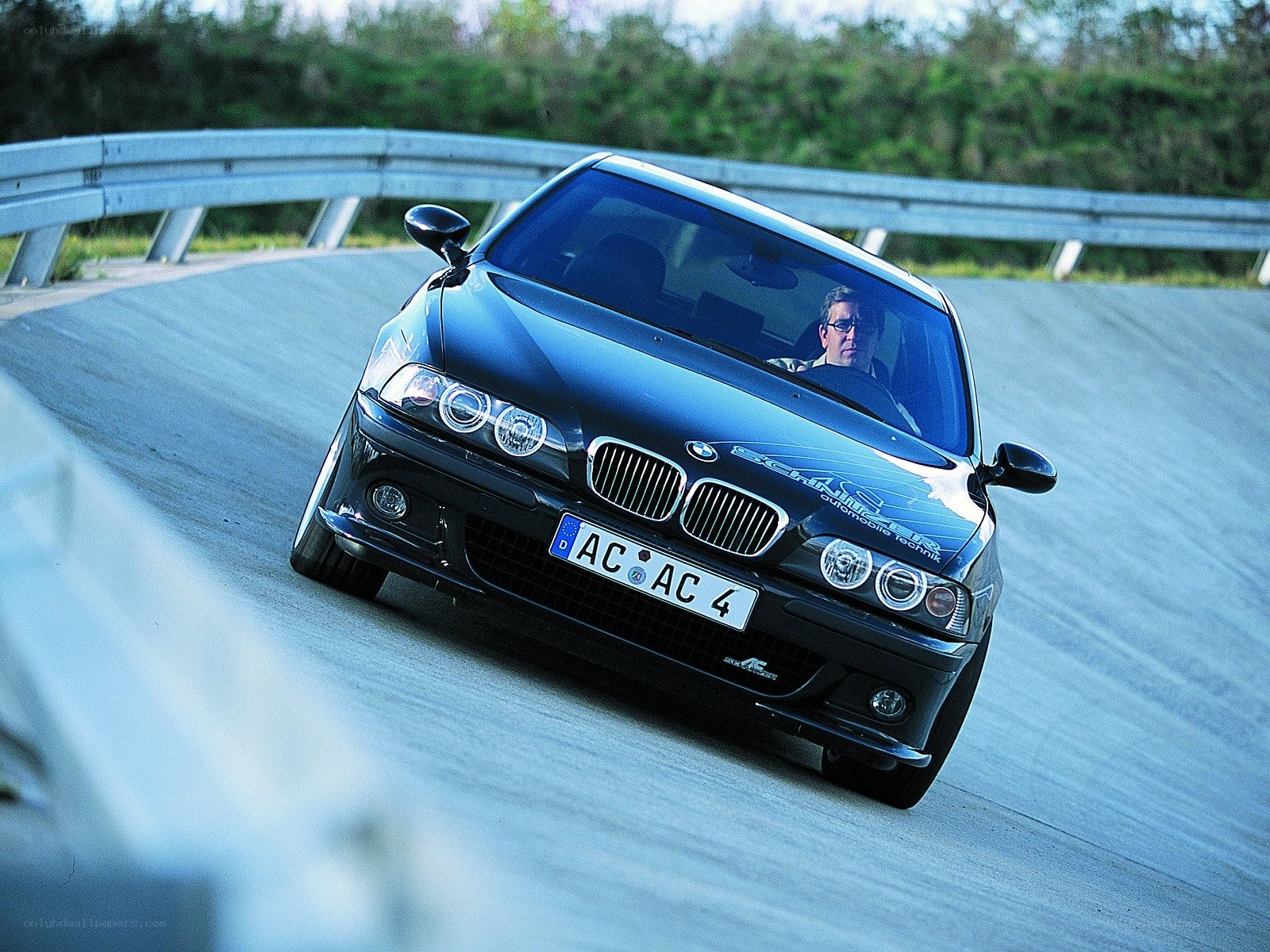 black bmw on a winding road