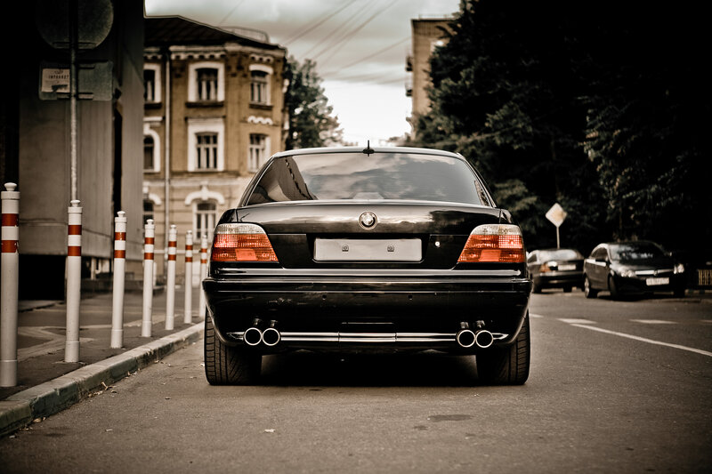 Black BMW on city street