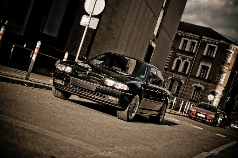 Black BMW on city street