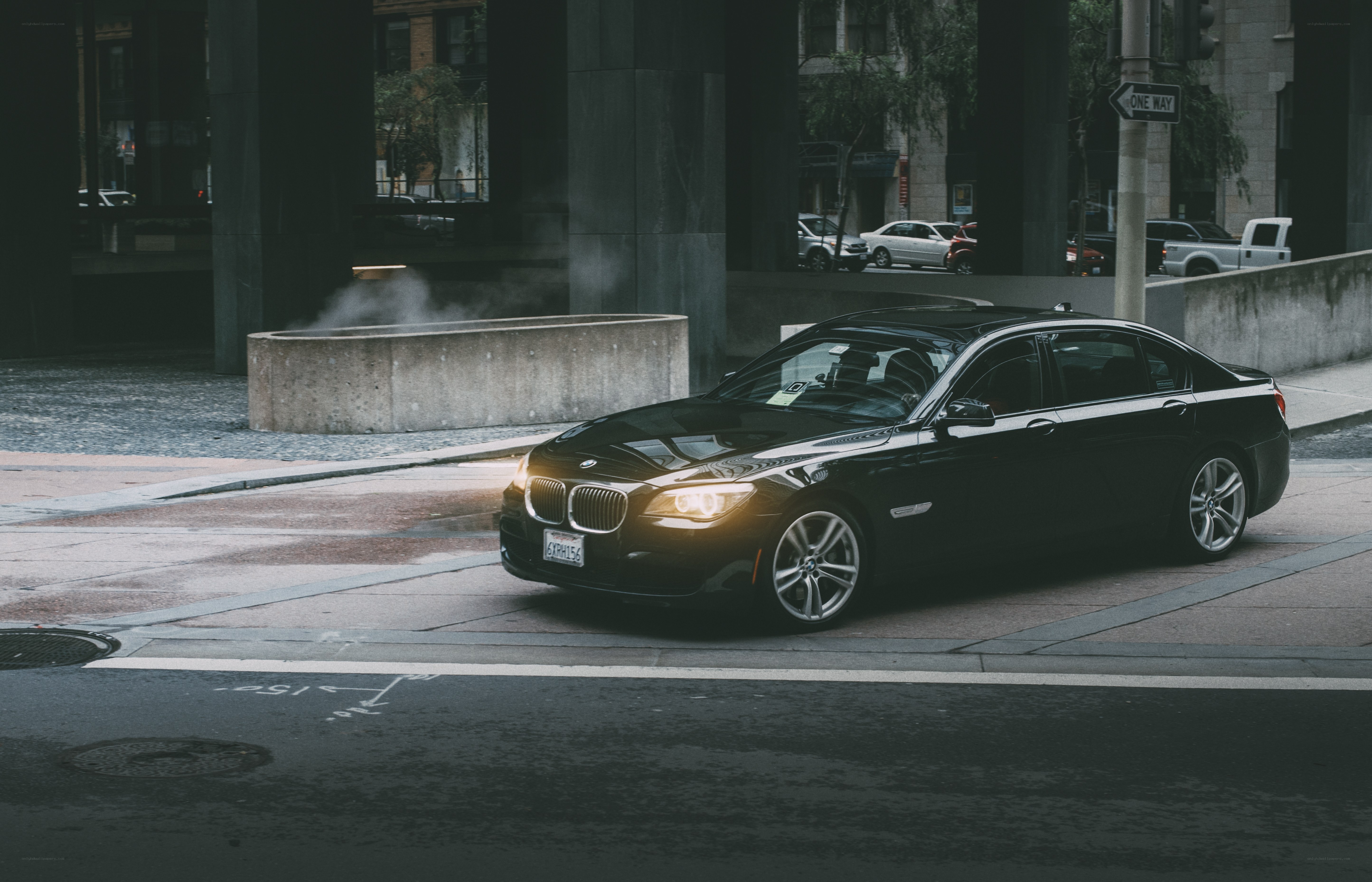 Black BMW on city street