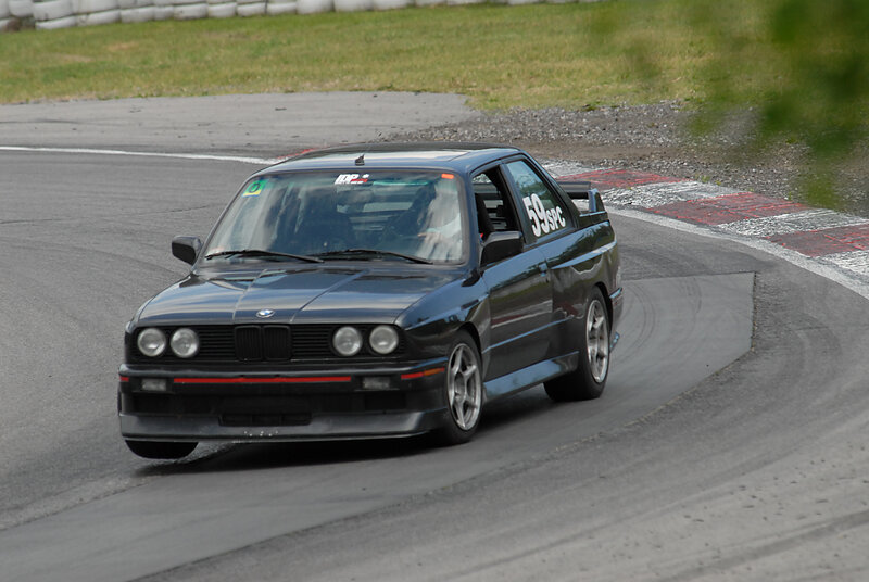 Black BMW on racetrack
