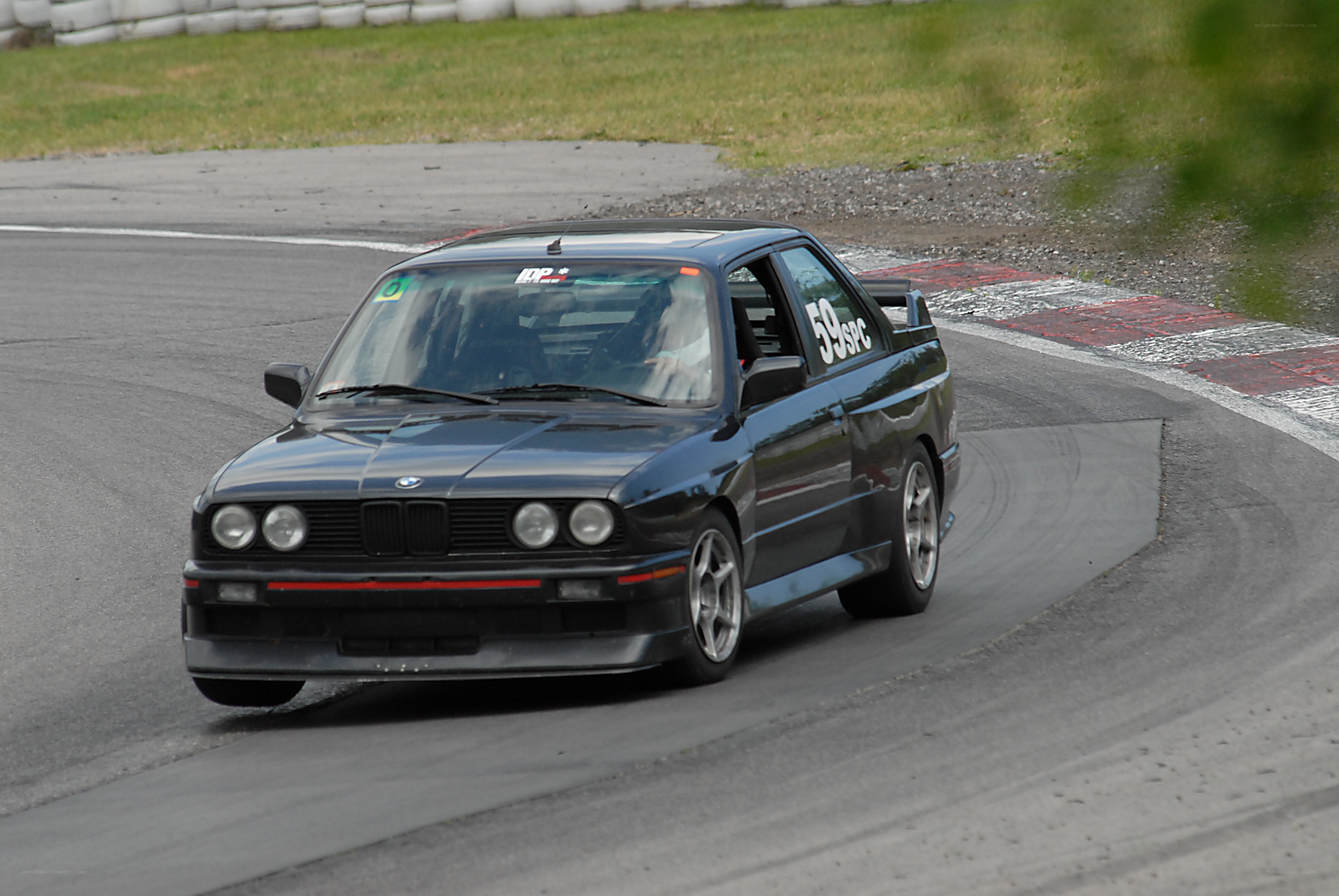 Black BMW on racetrack