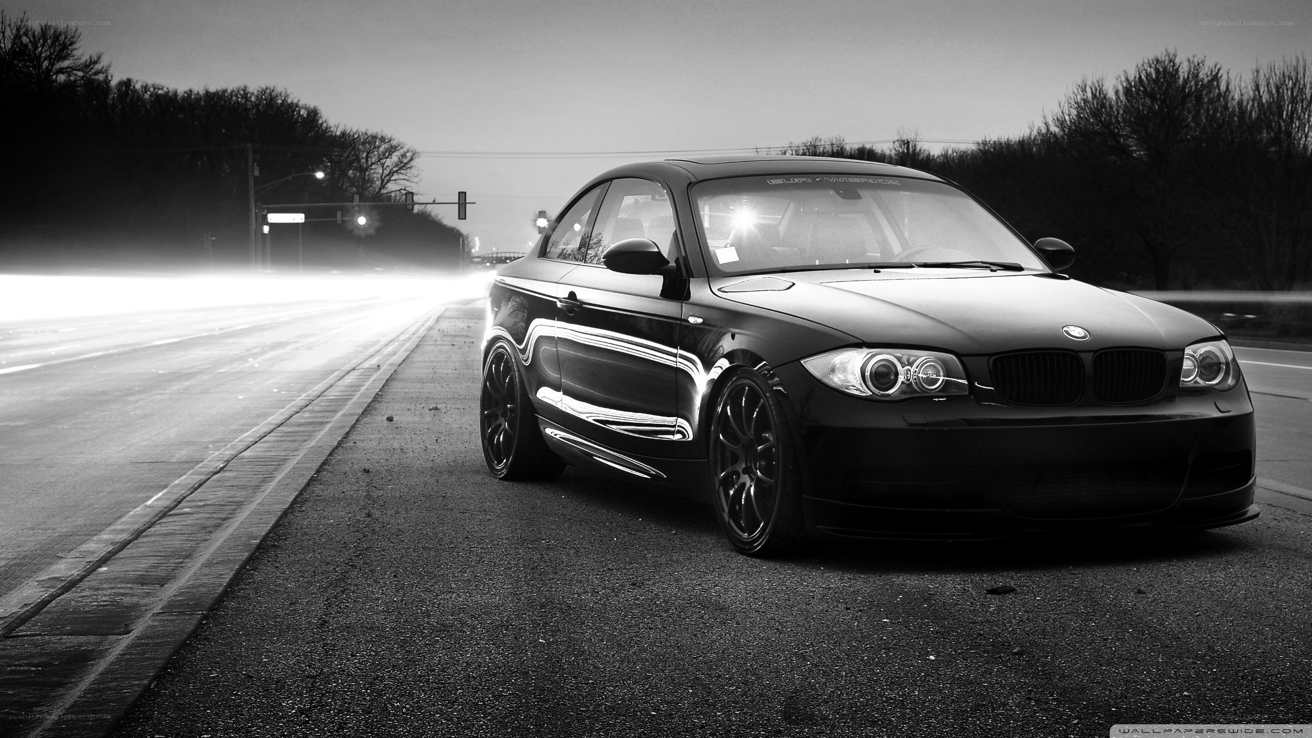 black bmw on road at night