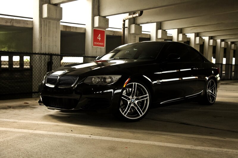 Black BMW parked in garage