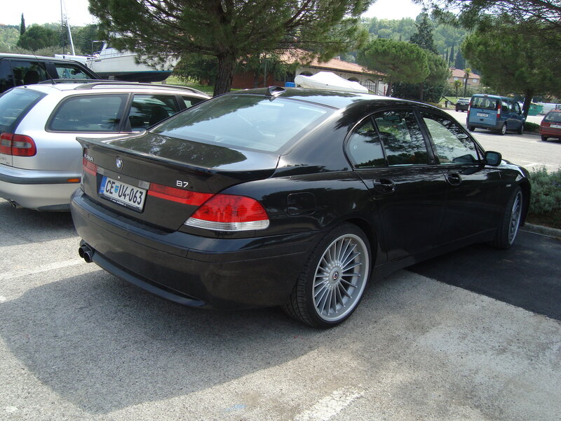Black BMW parked in lot