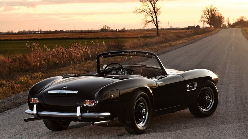 Black BMW roadster on country road