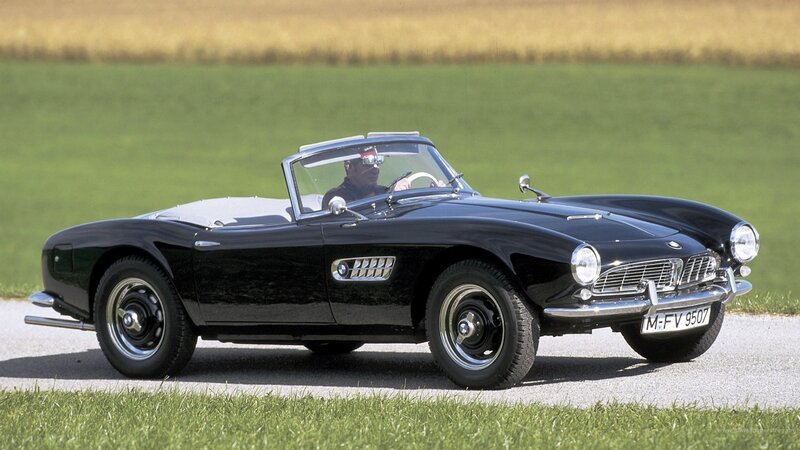 Black BMW roadster on country road
