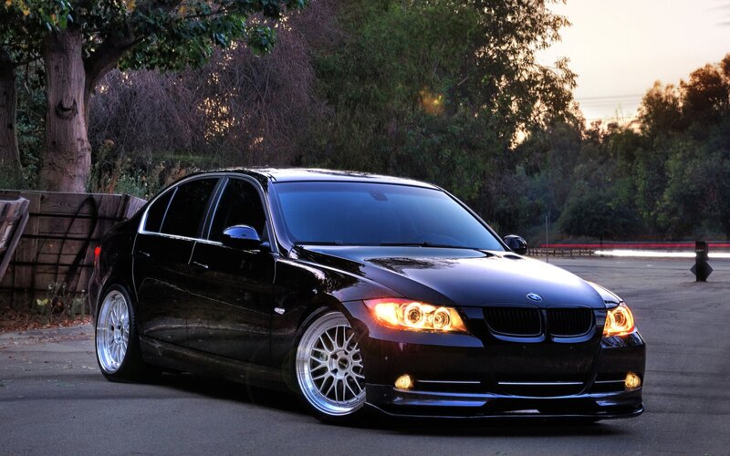 Black BMW sedan at dusk