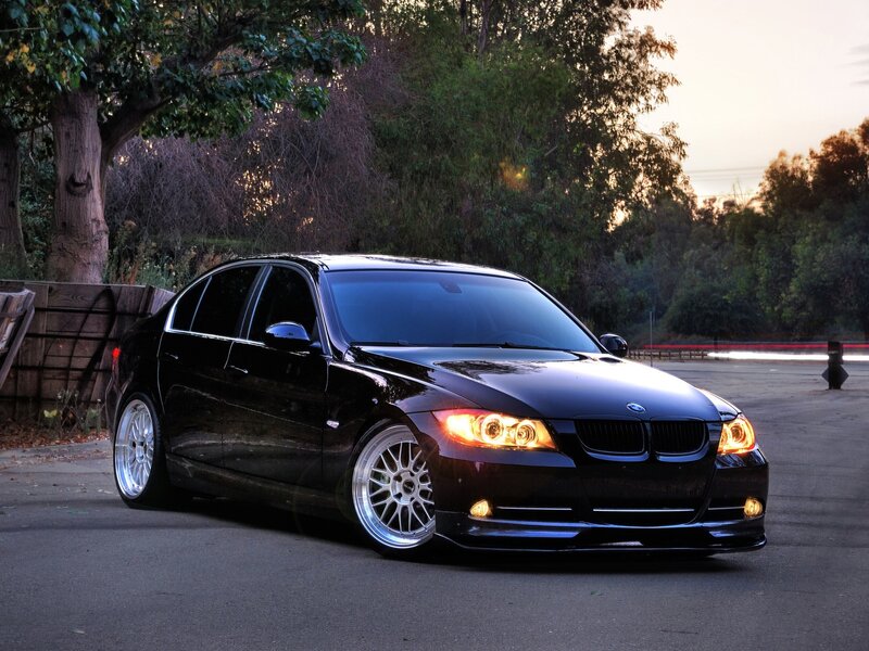 black bmw sedan at dusk