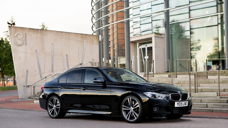 Black BMW Sedan — Calm, Afternoon, Photograph, Building