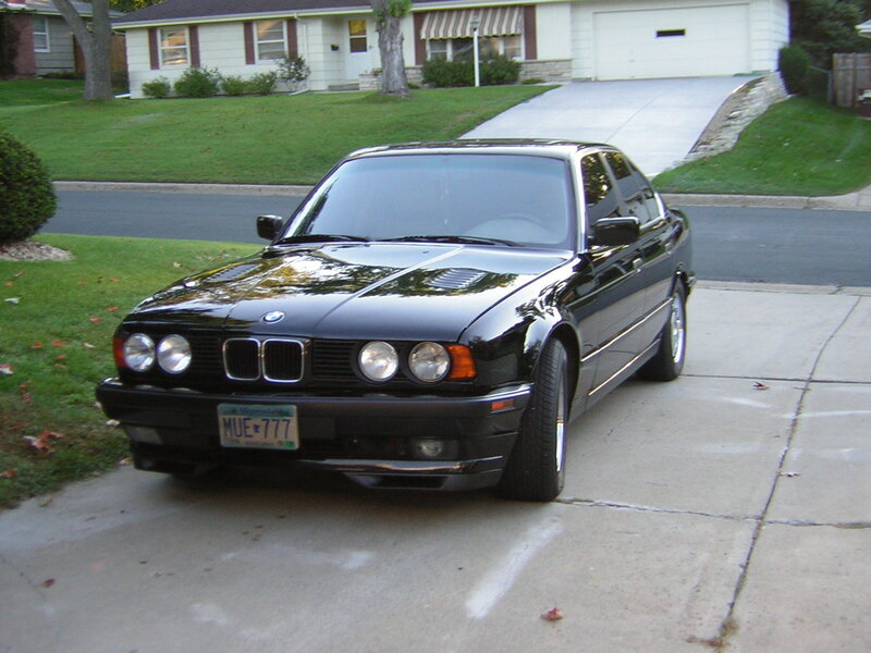 Black BMW Sedan — Calm, Autumn, Photograph