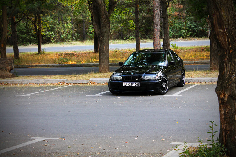 Black BMW Sedan — Calm, Autumn