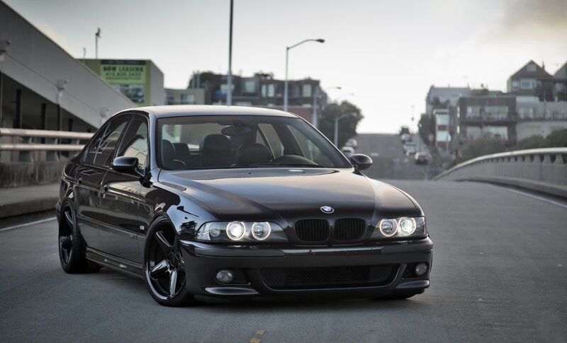 Black BMW Sedan — Calm, Sunset, Photograph