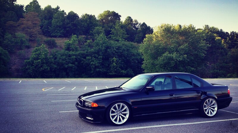 Black BMW Sedan — Calm, Sunset