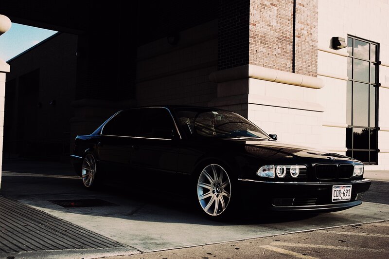 Black BMW Sedan — Dramatic, Afternoon, Photograph, Building, Concrete