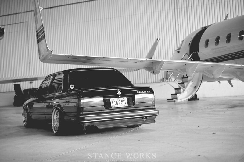 Black Bmw Sedan — Dramatic, Photograph, Airplane